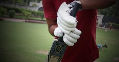 Heega-cricket-batting-glove-with-player